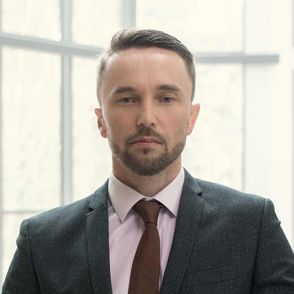 businessman standing at office RULJWSZ.jpg